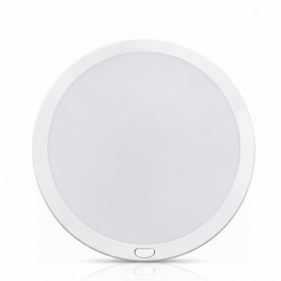 Round white light fixture on a white background