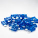 Pile of blue automotive fuses on a white background