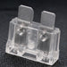 Clear plastic electrical component with metal contacts on a dark background