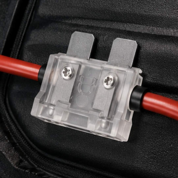 Electrical connector with red and black wires on a black background