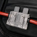 Electrical connector with red and black wires on a black background