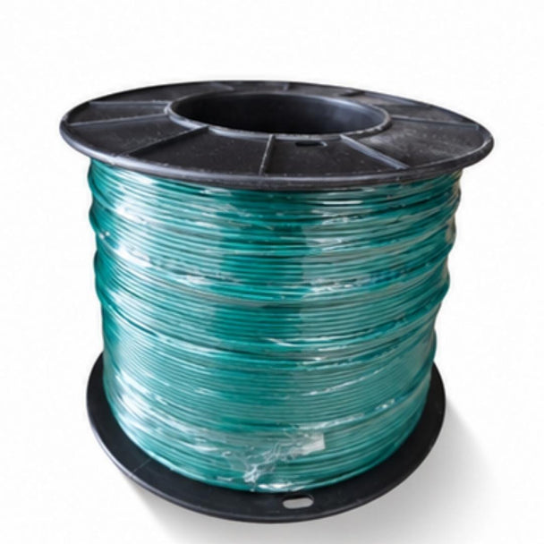 Spool of green cable on a white background