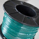 Spool of green filament on a black plastic reel