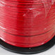 Spool of red wire on a white background