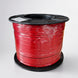 Close-up of a spool of white cable with visible copper wires, branded 'BROOKS'.