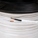 Close-up of a spool of white cable with visible branding.