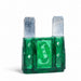 Green plastic fuse with metal blades on a white background