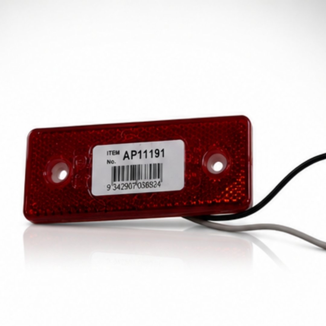 Red rectangular light with a label on a white background