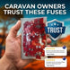 Hand holding a package of fuses with a 'Trust' badge and reviews on a blurred caravan background.