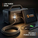 Portable power station with tablet and smartphone, featuring Outrak Power branding.