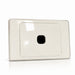 Beige rectangular wall plate with a central black square on a white background