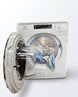 Silver washing machine with open door showing clothes inside on a white background