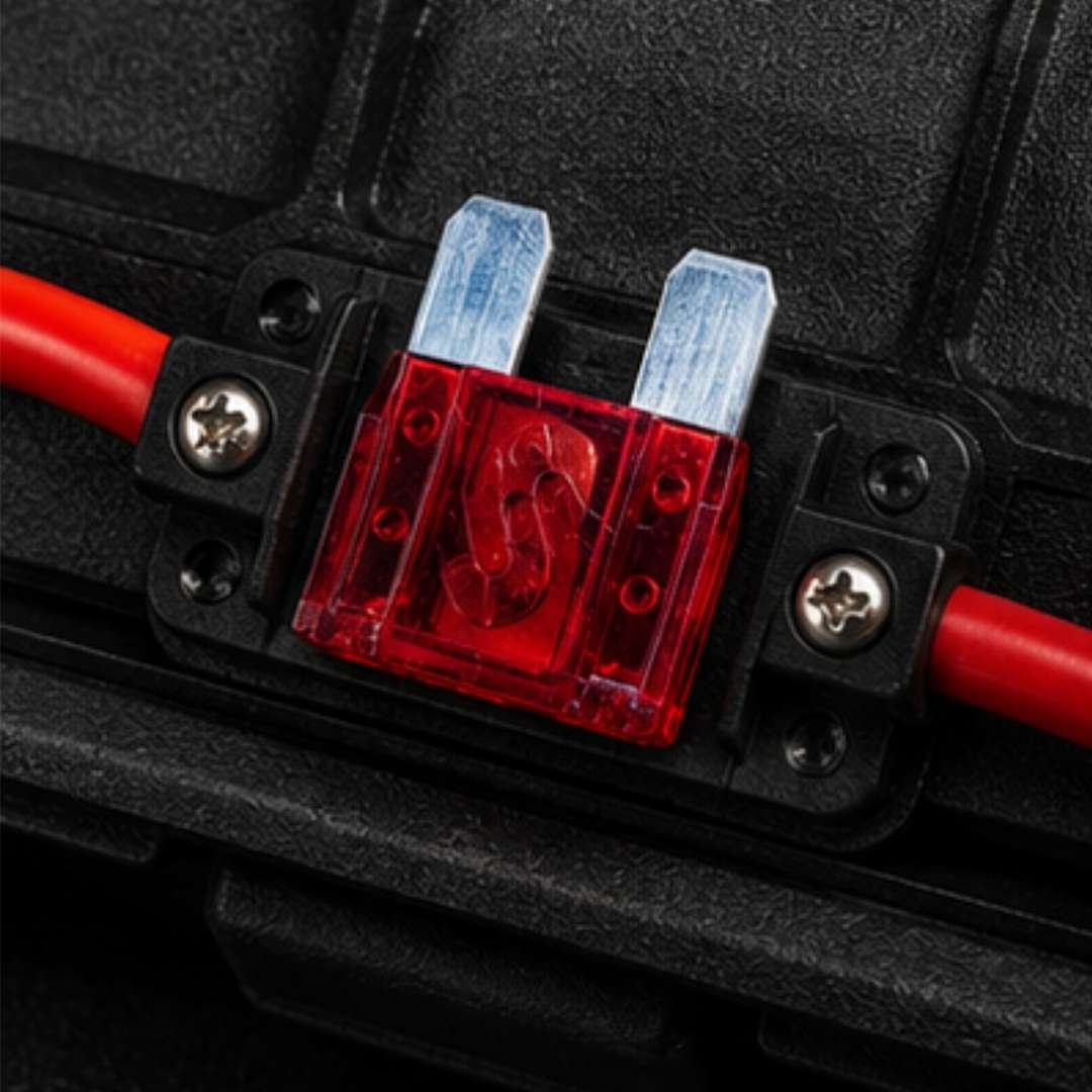Fuse holder with fuses and wires on a black background