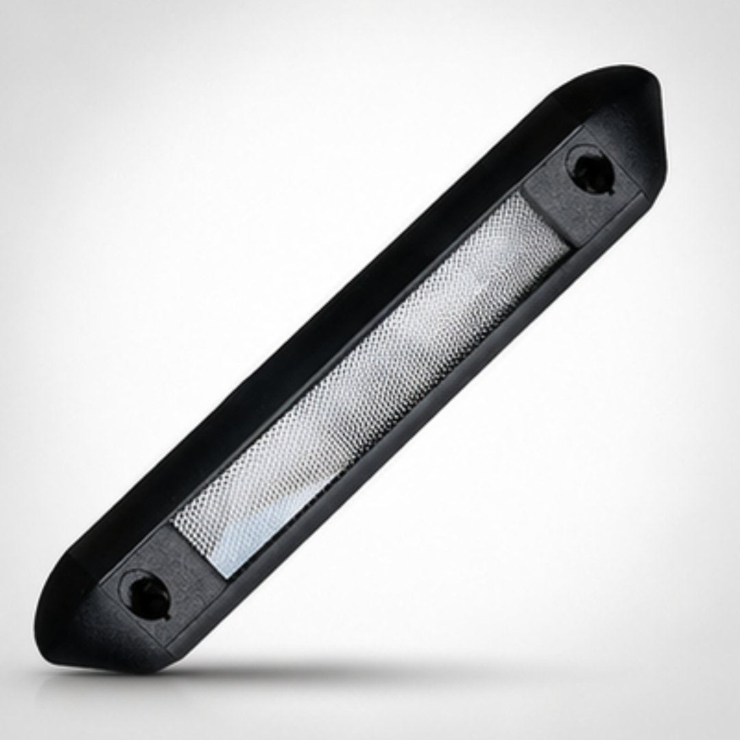 Black rectangular light fixture with mesh cover on a white background