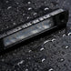 Black phone case with water droplets on a wet surface