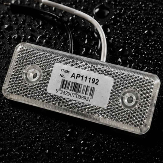 Rectangular electronic component with a label on a dark textured background