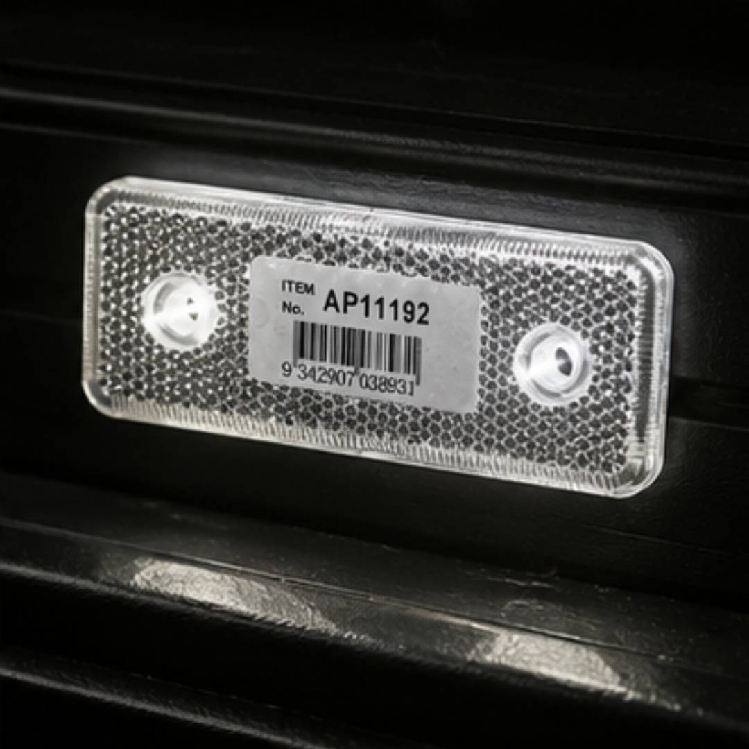 Red LED light on a vehicle with a visible barcode label.