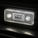 Red LED light on a vehicle with a visible barcode label.