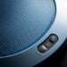 Close-up of a blue textured surface with control buttons