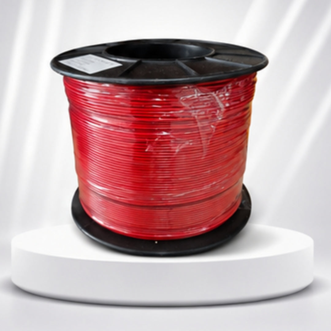 Spool of red wire on a white background