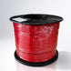 Spool of red wire on a white background